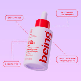 BEING INC smoothing oil onto curls to add definition and glossy shine