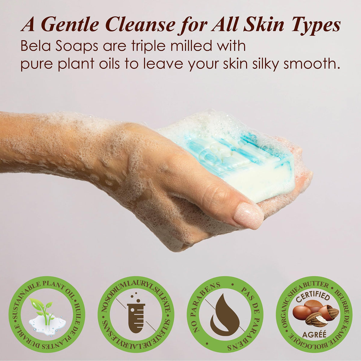 Person holding BELA soap bar lathering for gentle cleansing benefit