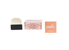 Close-up of Benefit Cookie powder texture highlighting silky, finely milled finish