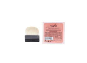 Model applying Benefit Cookie highlighter to cheekbone for natural luminous radiance