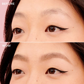 Model using Benefit pencil and spoolie to blend brows for natural fuller-looking shape