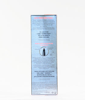 Benefit pencil held next to a ruler showing compact travel size
