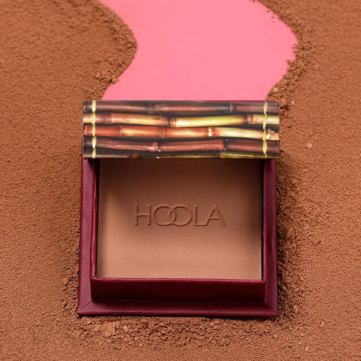 Benefit Hoola in makeup bag lifestyle shot showing easy portability and everyday warming benefit