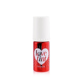 Benefit tint on model applying to lips and cheeks for vibrant wear