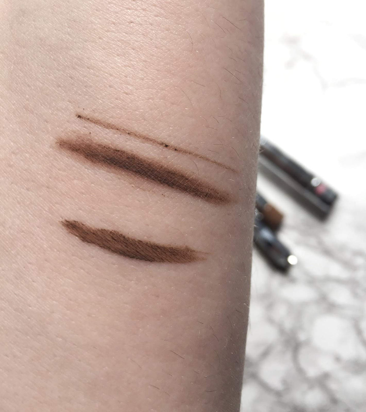Benefit mini Ka-BROW! cream texture close-up demonstrating smooth pigment