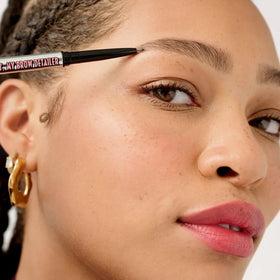Benefit Precisely My Brow Detailer swatches on skin illustrating buildable neutral medium