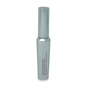 Benefit primer applied to lashes in lifestyle scene for defined, feathery lash look