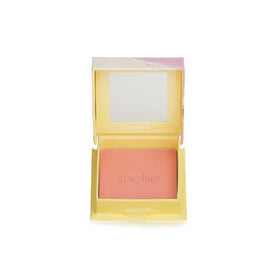 Benefit swatch on skin displaying warm-pink flush and blendability