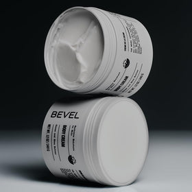 Bevel jar in hand for scale to highlight generous 12 oz size and portability