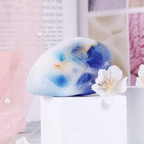 Bff Beauty Garden soap next to coin for size comparison, clarifying travel-friendly scale