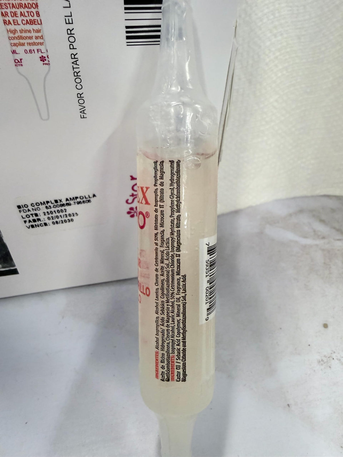 Bio Complex ampoule in hand applying to damp hair for instant softness benefit