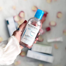 Bioderma in hand for scale showing large one-liter economical size