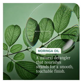 Biolage applying oil through mid-lengths and ends for smoother styling results