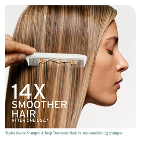 Biolage applying mask in shower for quick weekly hydration routine