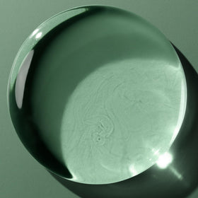 Biolage tube in hand for scale, illustrating compact travel-friendly size