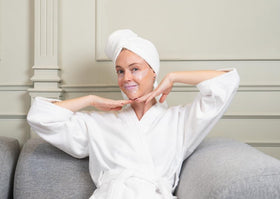 Drop of serum on fingertip highlighting BioRepublic hyaluronic and peptide-rich texture