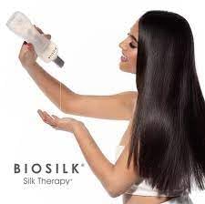 BioSilk 12 oz bottle in hand for scale, showing generous salon-size convenience