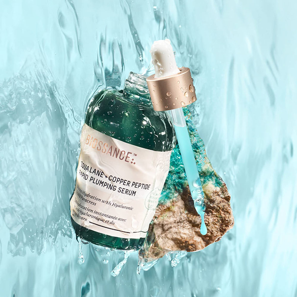 Biossance dropper dispensing serum highlighting lightweight texture for fast absorption