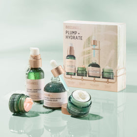 BIOSSANCE bottles next to a hand for clear size and travel-friendly scale
