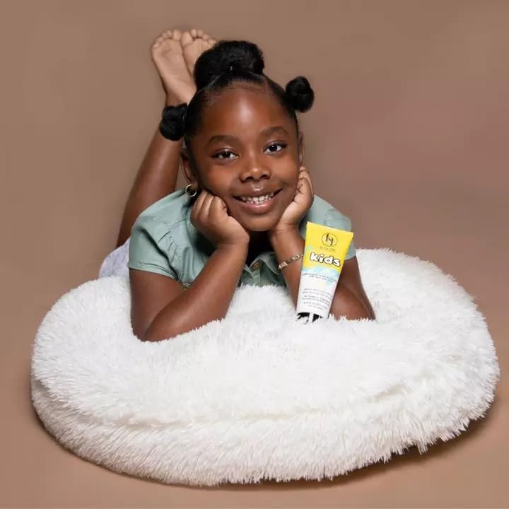 Black Girl Sunscreen in a beach travel scene protecting kids during play