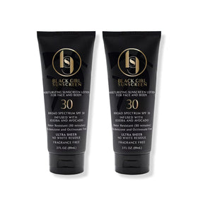 Black Girl Sunscreen front packaging showing two travel bottles and SPF benefit