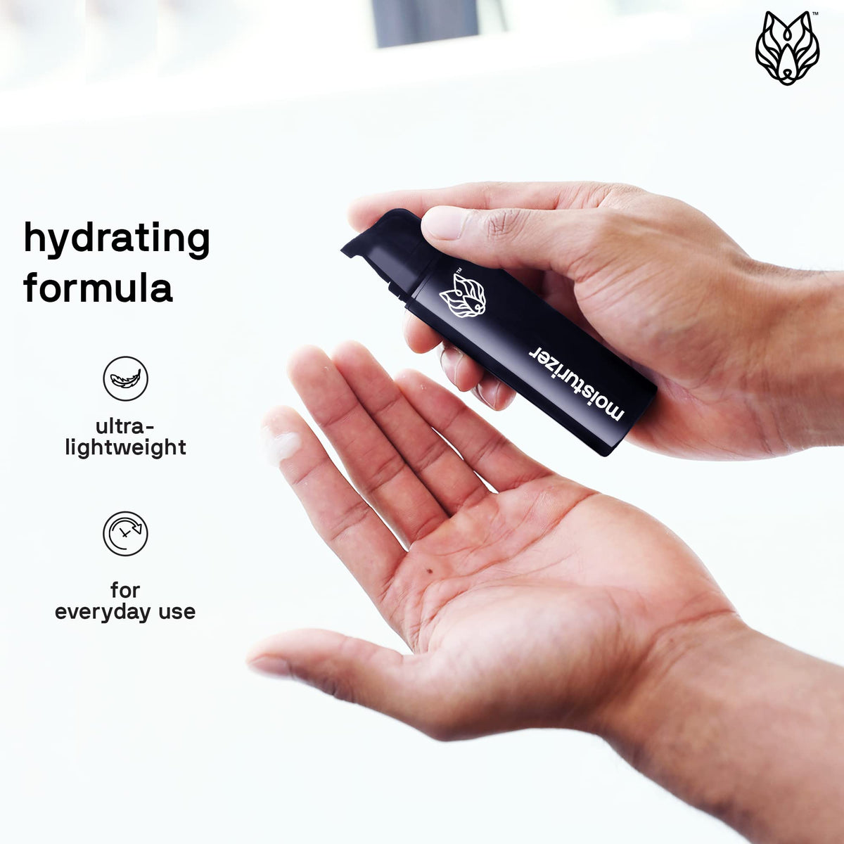 Black Wolf 1.7 fl oz bottle next to a coin showing compact travel-friendly size advantage