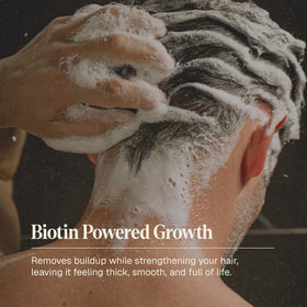 Black Wolf shampoo being applied in hand showing easy distribution and lift