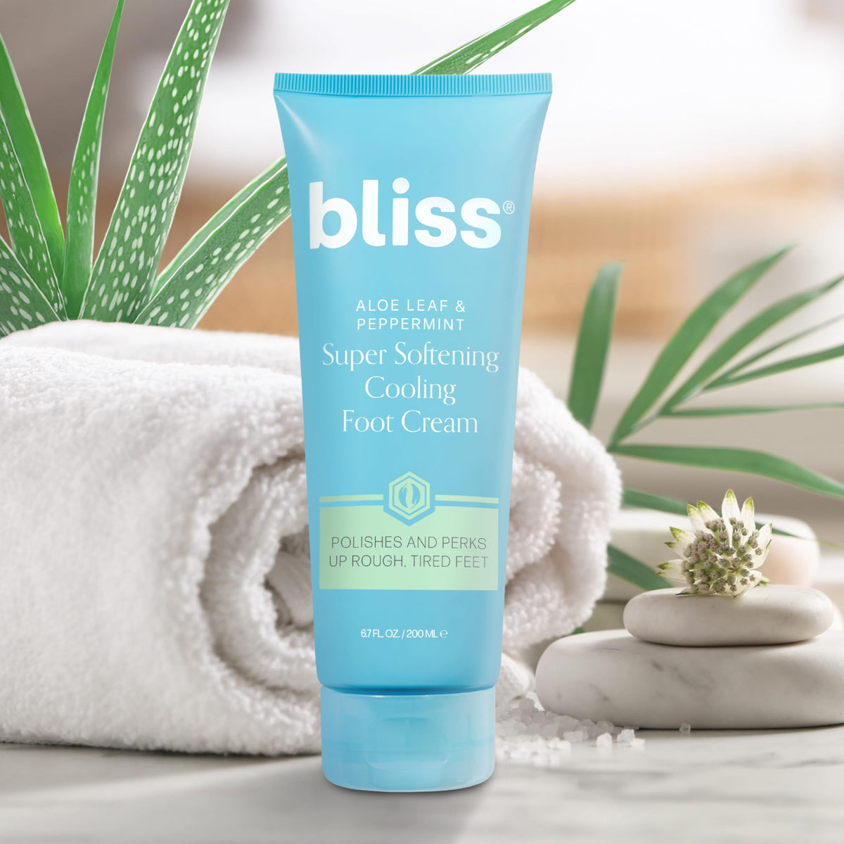 Bliss 4 fl oz tube with product beside toes for scale and usage clarity