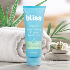 Bliss 4 fl oz tube with product beside toes for scale and usage clarity