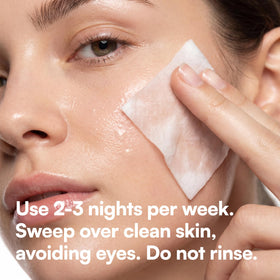 Bliss packet placed with luggage highlighting travel-friendly exfoliating pads
