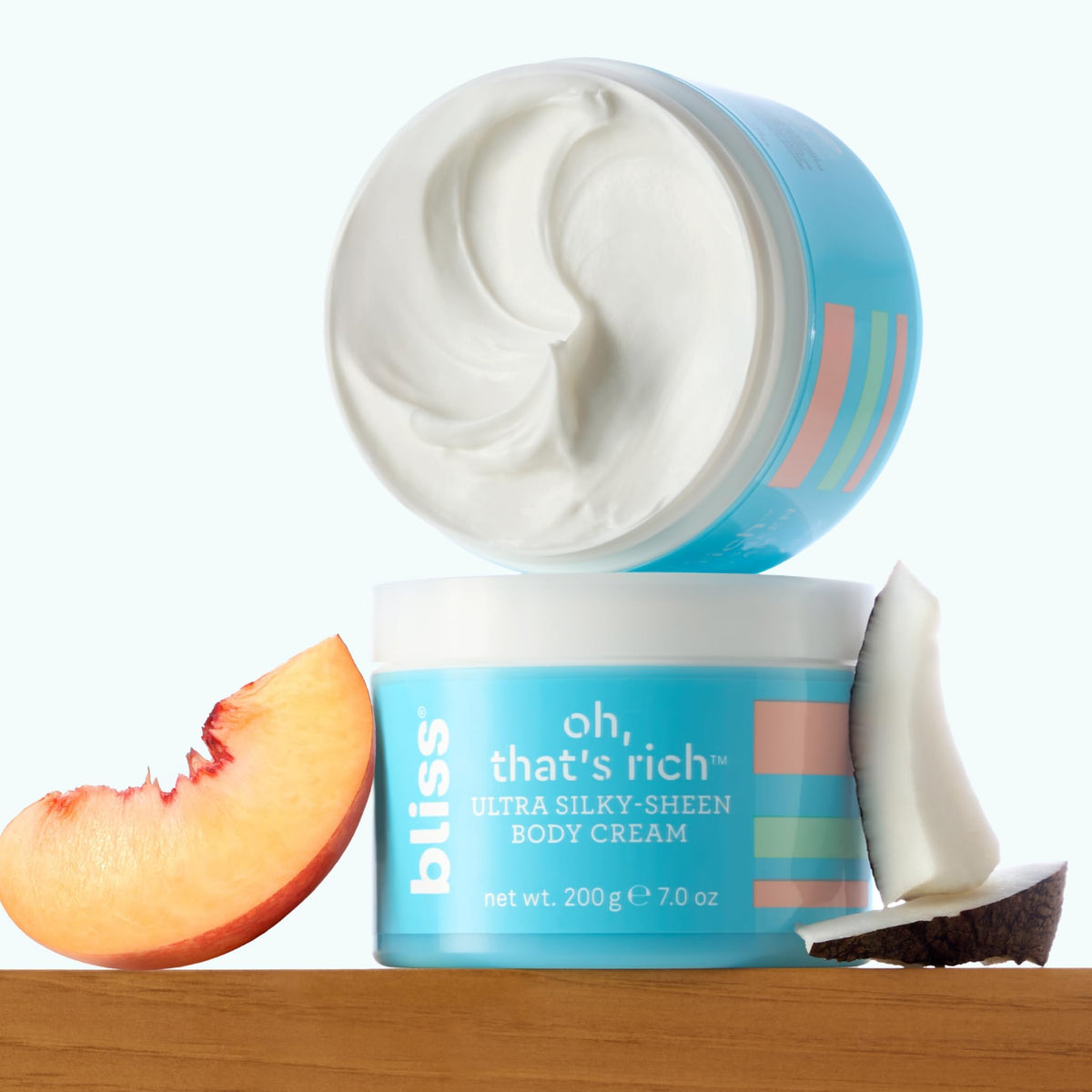 Bliss label close-up showing ingredient highlights like coconut and shea for nourishment