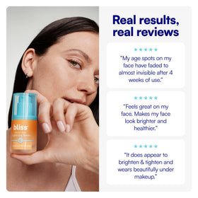 Person applying Bliss serum on cheek to show layering under moisturizer