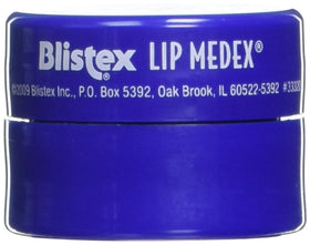 Twelve-count Blistex Lip Medex pack arranged next to a coin for size comparison