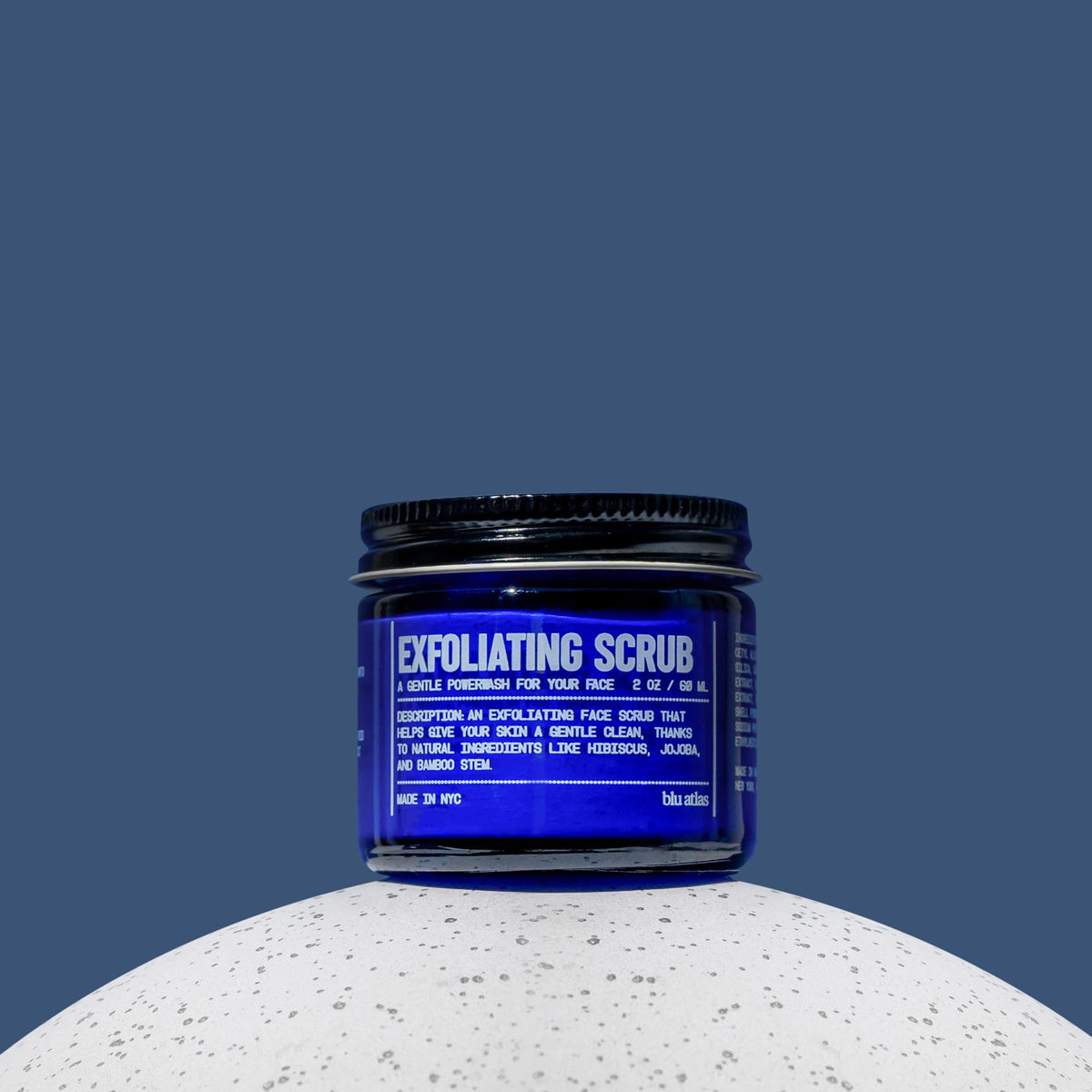 Blu Atlas product in hands applying to damp skin for refreshed feel