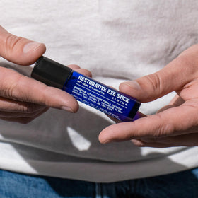 Blu Atlas roller ball close-up displaying metal applicator and cooling effect benefit