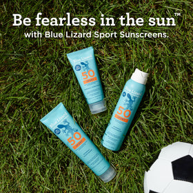 Blue Lizard bottle on surfboard illustrating sport use and water resistance