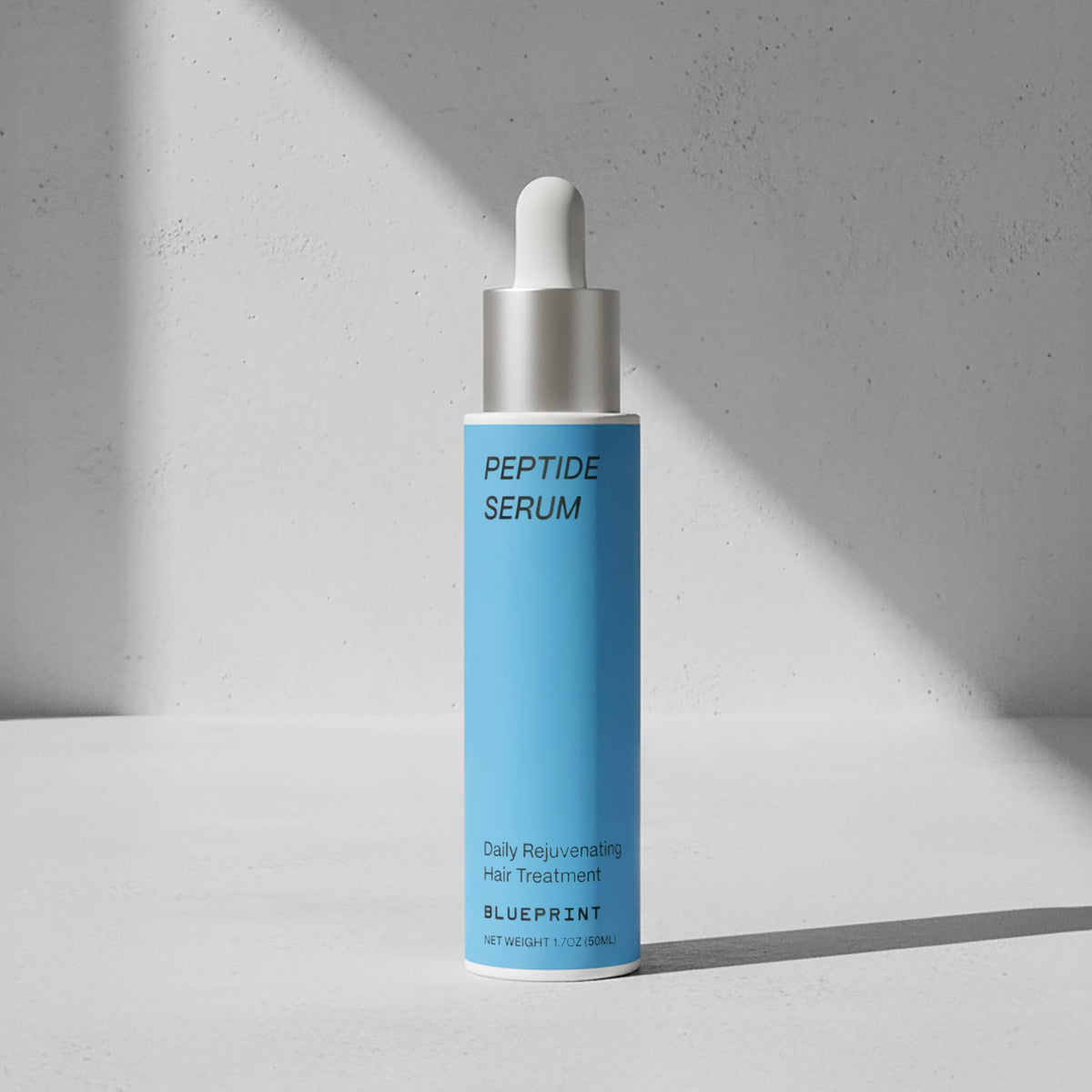 Blueprint Bryan Johnson dropper applying serum to scalp for targeted delivery benefit