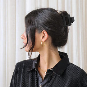Bmobuo clip worn in hair half-up style illustrating reliable grip and neat look