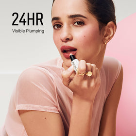 Bobbi Brown swatch on skin showing sheer Bare Peony color and glow