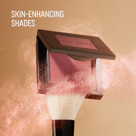 Bobbi Brown blush with brush picking up product for smooth application