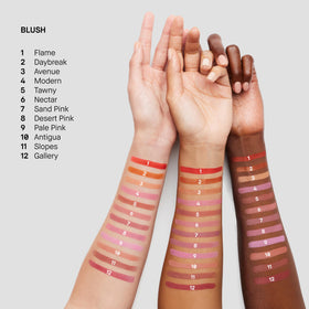 Bobbi Brown lifestyle woman applying blush giving a healthy, camera-ready glow