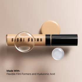 Bobbi Brown concealer in a makeup bag lifestyle shot showing travel‑ready convenience