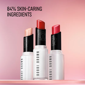 Bobbi Brown tube beside everyday items showing portable size benefit