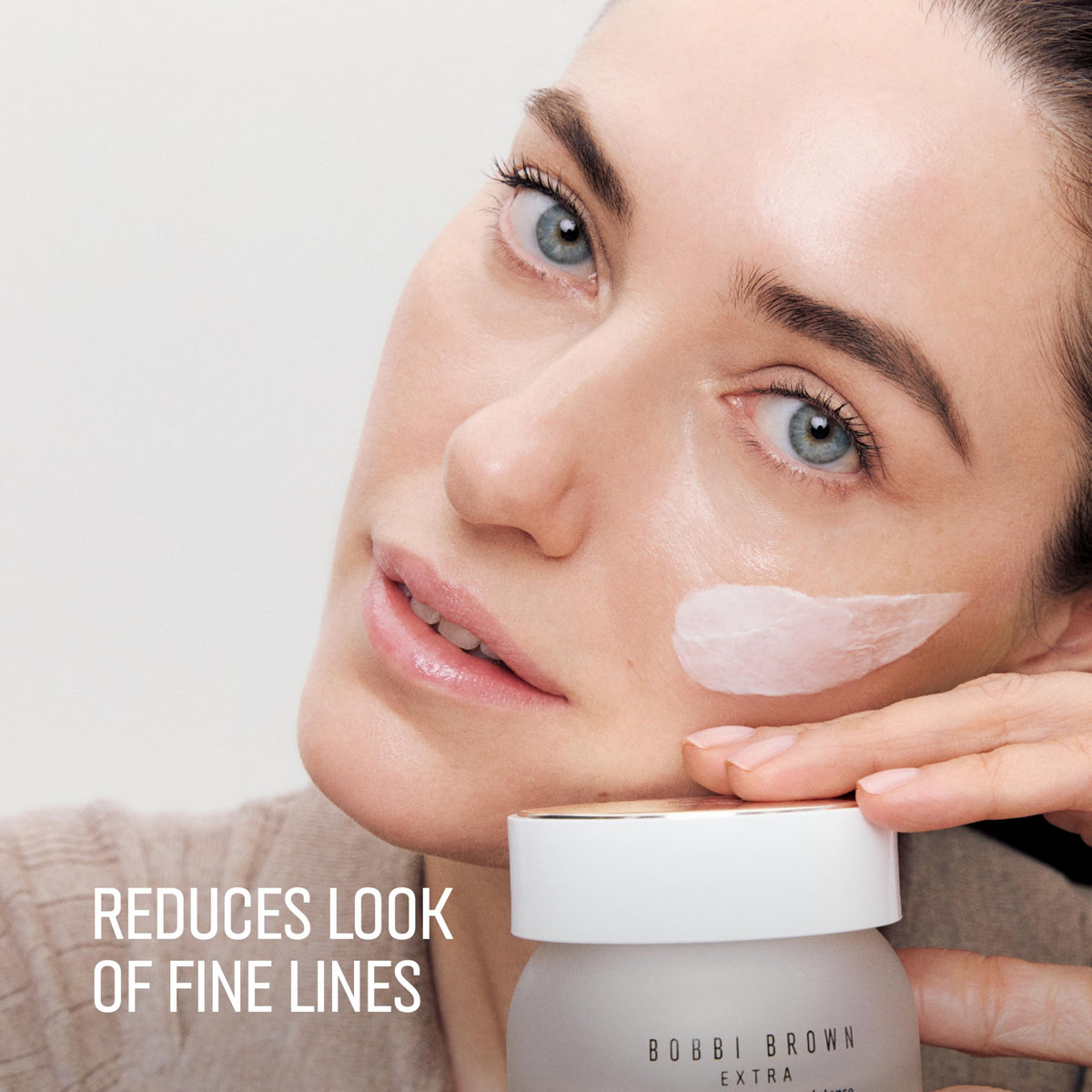 Bobbi Brown demonstration inserting refill pod into jar for easy reuse and low waste benefit