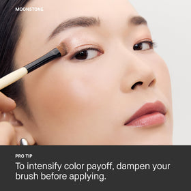 Bobbi Brown Luxe Eyeshadow Moonstone on vanity styled with brushes showing polished look benefit