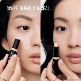 Bobbi Brown concealer stick beside foundation, layers seamlessly for natural look