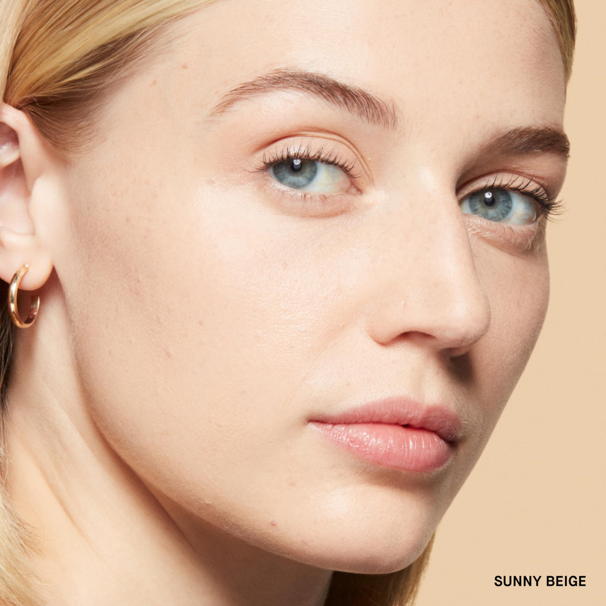 Bobbi Brown powder swatch on skin demonstrating sheer, blurring coverage
