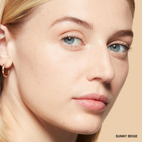Bobbi Brown powder swatch on skin demonstrating sheer, blurring coverage
