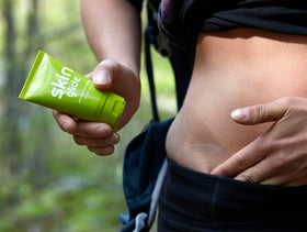Runner applying BodyGlide before activity showing reliable anti-chafe protection