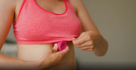 BodyGlide placed beside a bra and clothing showing fabric-safe protection
